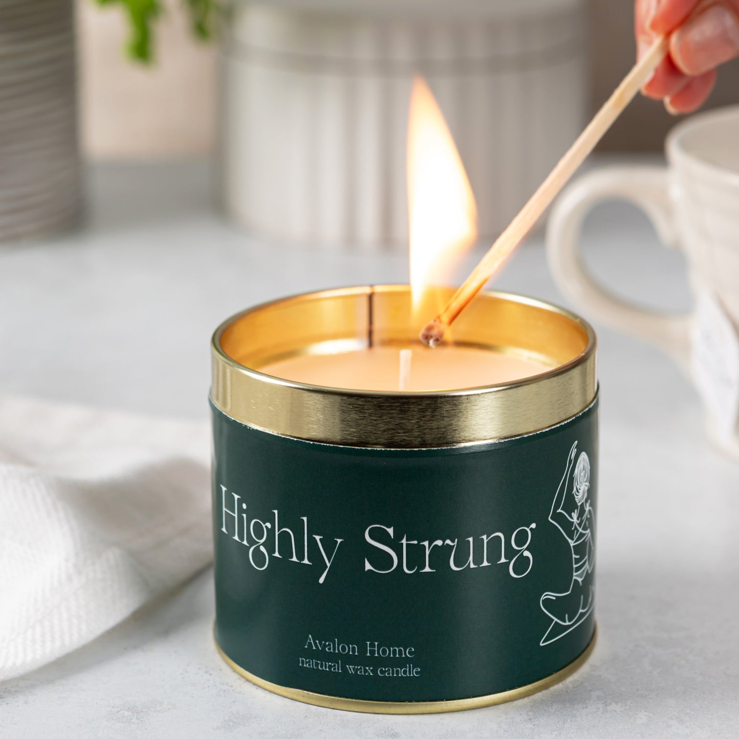 Highly Strung Tin Candle